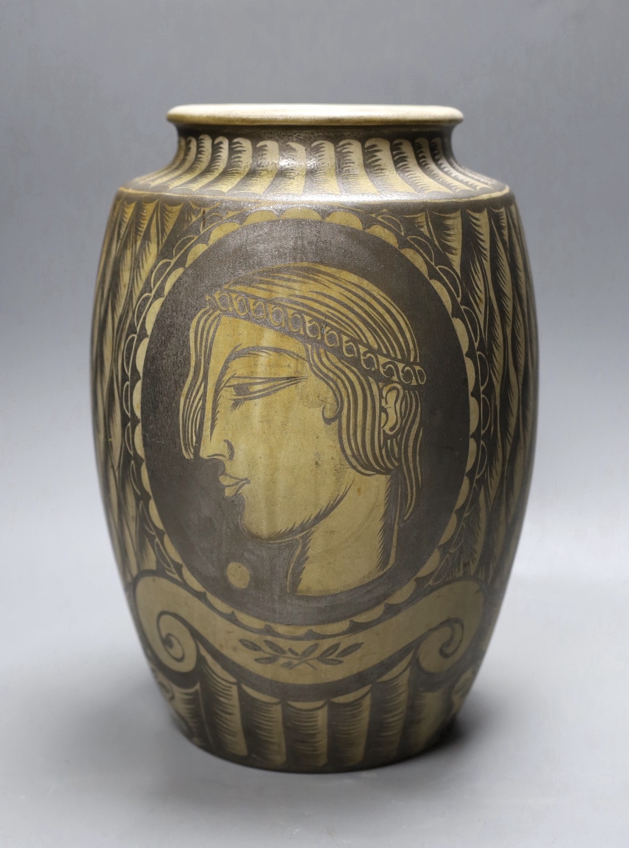 A possibly unique Royal Doulton Lambeth stoneware silver lustre vase, c.1936, painted with Greek style heads on a feather ground, inscribed ‘A*E*B 1936’, impressed marks to base, 30.5 cm high